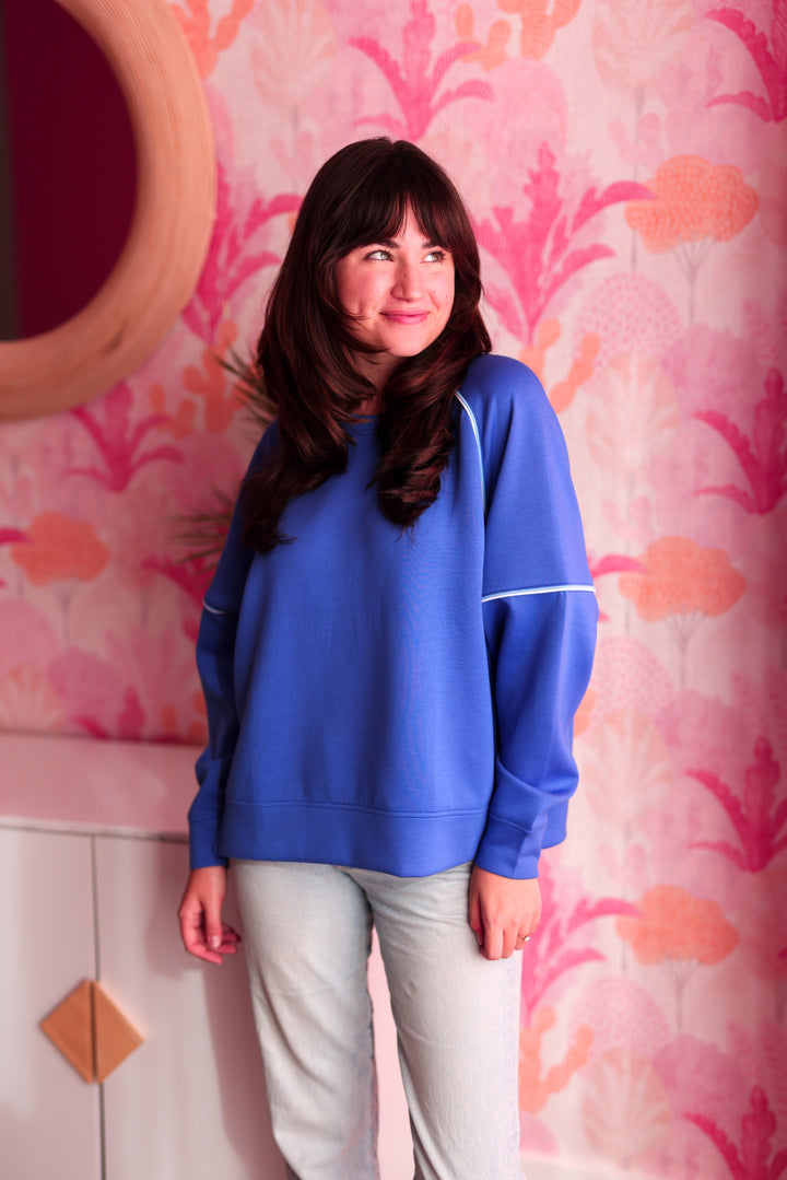 Cozy blue sweatshirt for women, featuring relaxed fit and soft fabric, perfect for casual outings.