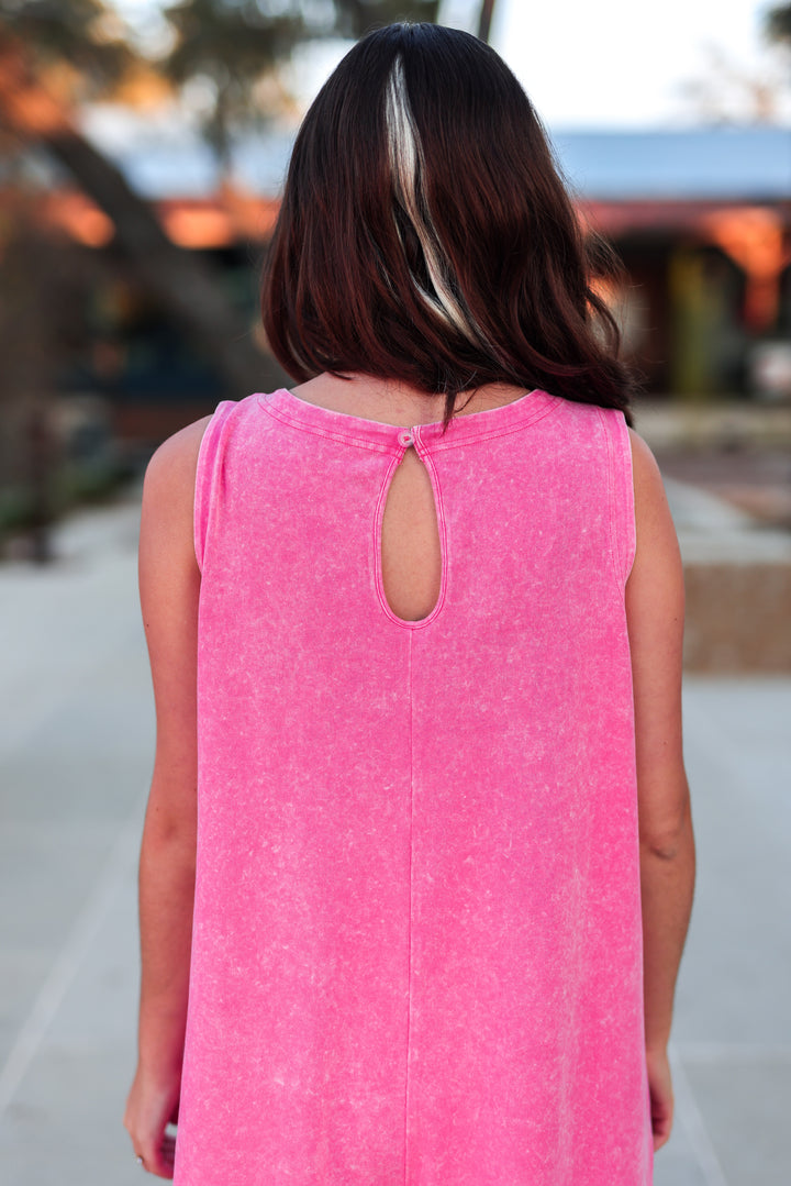Bright pink sleeveless dress with a keyhole back design, stylish and casual for summer wear.