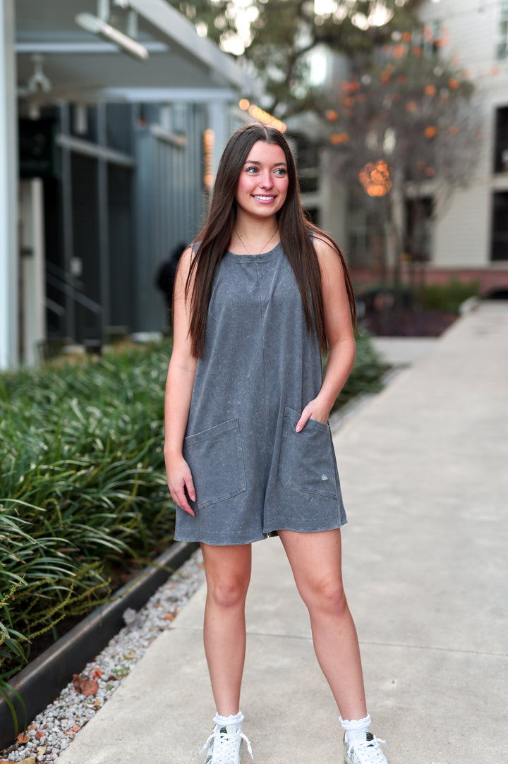 Gray sleeveless romper with pockets, casual summer style, perfect for warm weather outings.