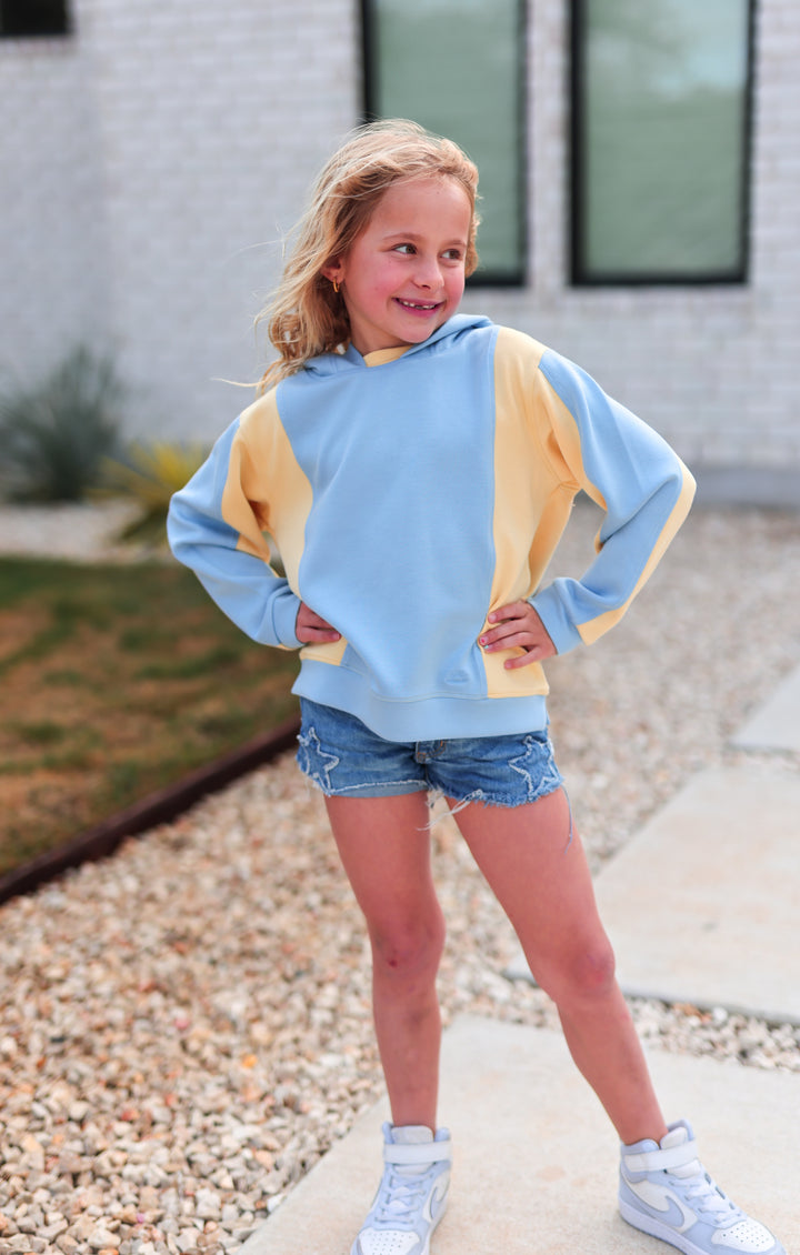 Kids' colorblock hoodie in light blue and yellow, made of soft cotton, perfect for casual wear.