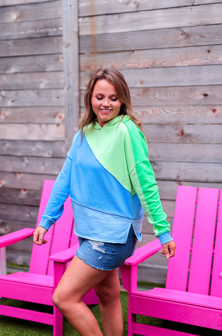 Colorful lightweight hoodie in blue and green, perfect for casual wear, made from soft cotton material.