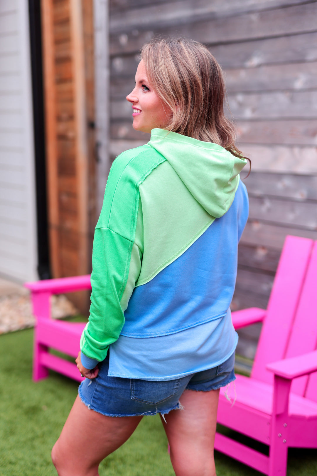 Women's colorblock hoodie in green and blue, made of soft cotton for comfort and style.