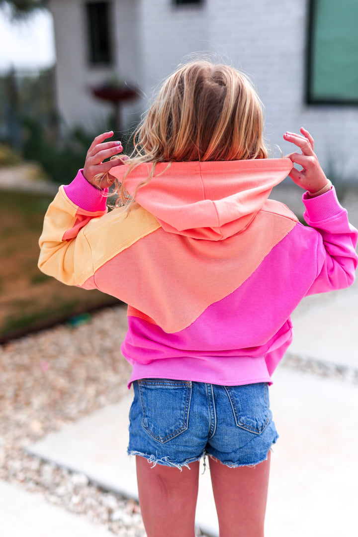 Colorful girls' hoodie in pink, orange, and yellow, perfect for casual wear.