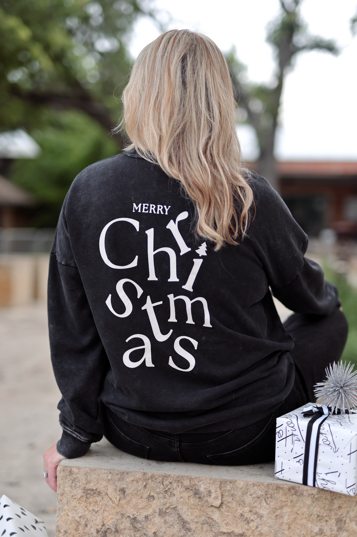 Black Merry Christmas sweatshirt for women, cozy and festive, perfect for holiday celebrations.