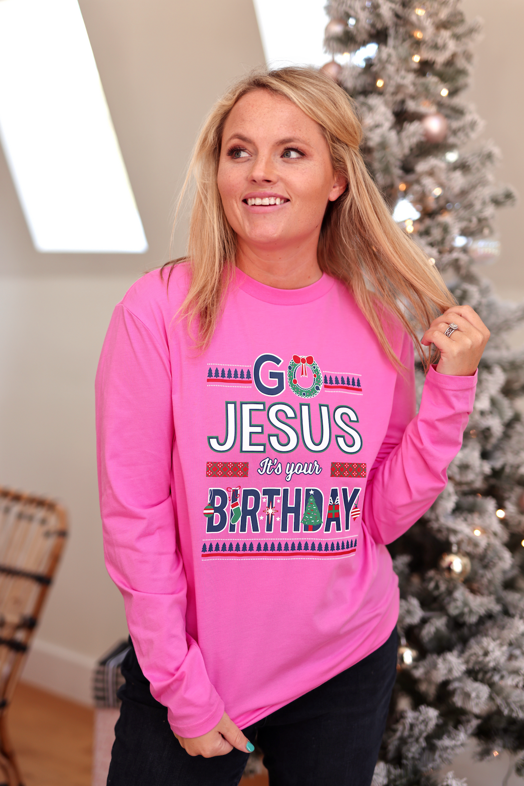 Pink long sleeve shirt with festive 'Go Jesus It's your Birthday' graphic, perfect for holiday celebrations.