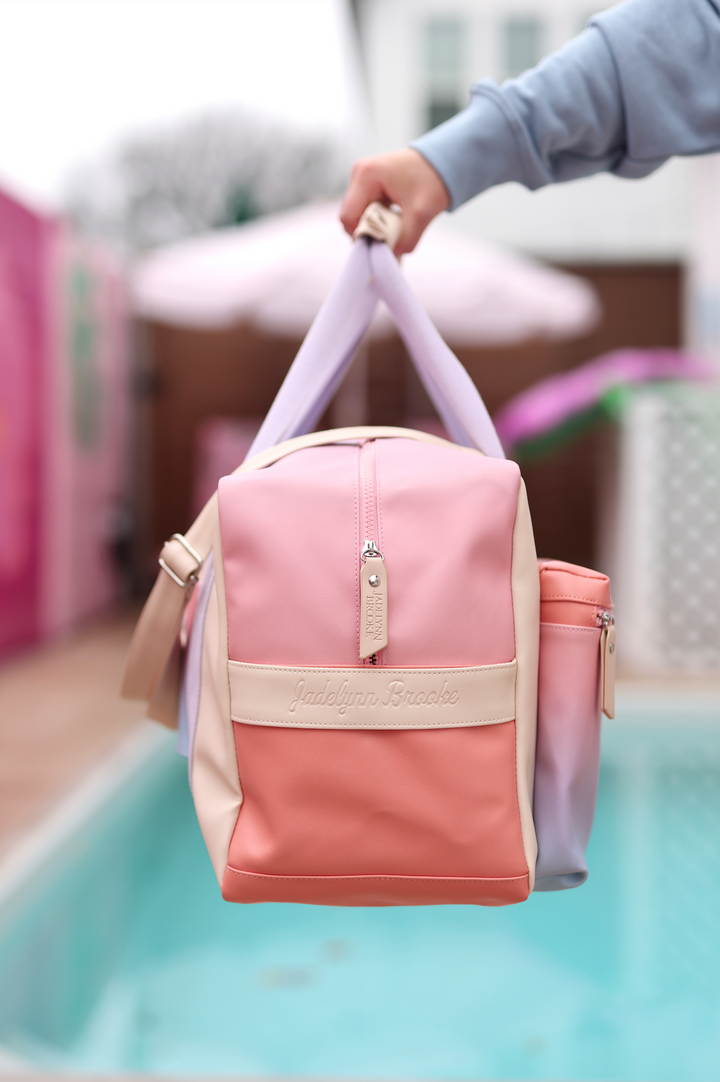 Stylish multi-colored tote bag in pink and cream with adjustable straps by Jadelynn Brooke.