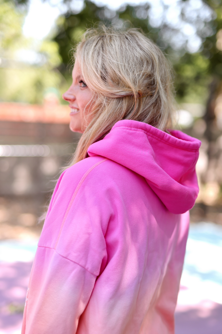 Women's pink gradient hoodie, soft fabric, relaxed fit, perfect for casual wear or lounging.