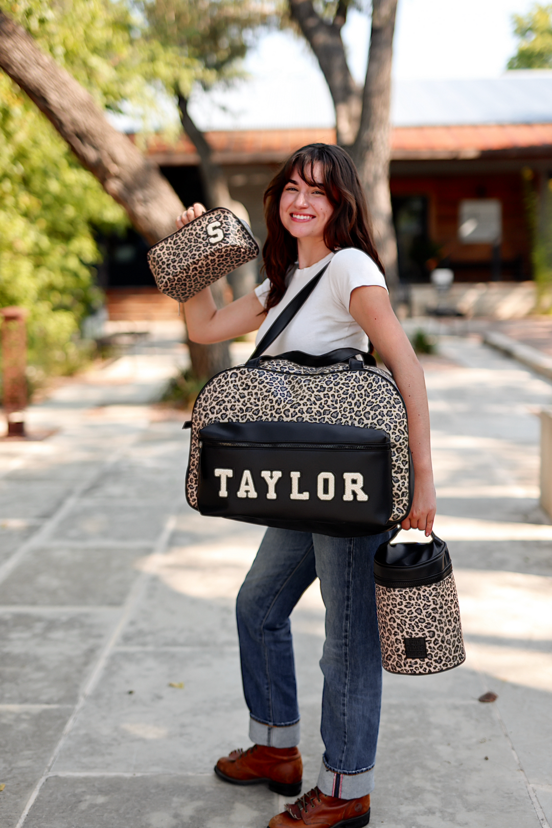 Leopard print tote bag with personalized TAYLOR, accompanied by matching cosmetic case and mini bag.