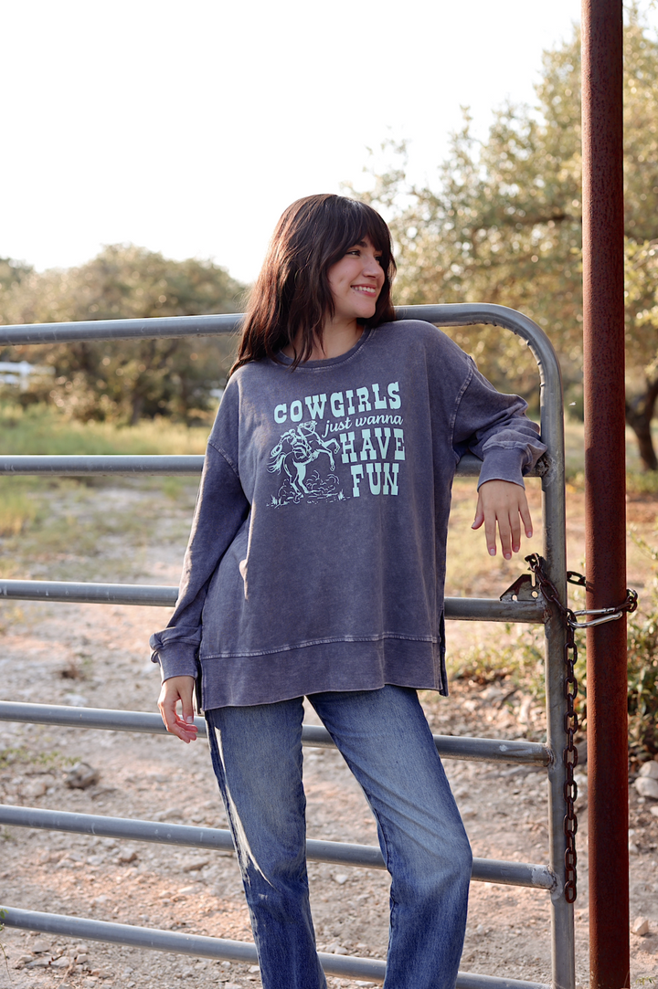Women's oversized gray sweatshirt with 'Cowgirls Just Wanna Have Fun' graphic, casual style for laid-back outfits.