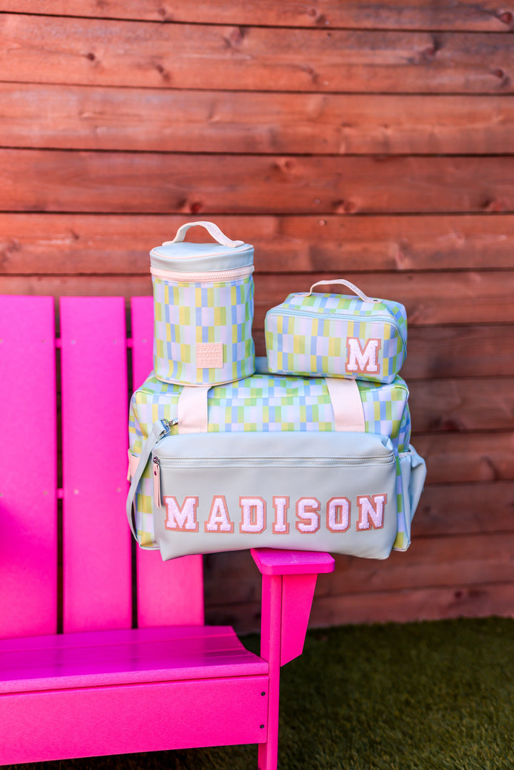 Colorful patterned travel bag set with insulated cooler, grey and pastel shades, personalized with Madison.